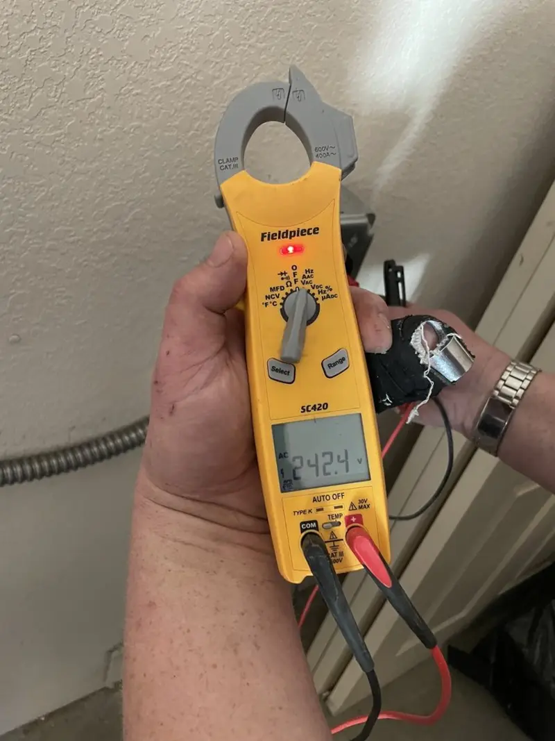 Voltage testing with clamp meter during Electrical Installation Services in Grant-Valkaria